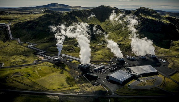 Air photograph of Reykjavik Energy's Hellisheidi geothermal power plant. The current emissions of the powerplant are: 40,000 tons CO2/year and 12,000 tons H2S/year. The CarbFix I pilot CO2 injection site is connected to the powerplant via a pipeline that delivered some of the CO2 and H2S gases that were injected into a basaltic storage reservoir at ~500 m depth below surface. Author: Árni Sæberg.